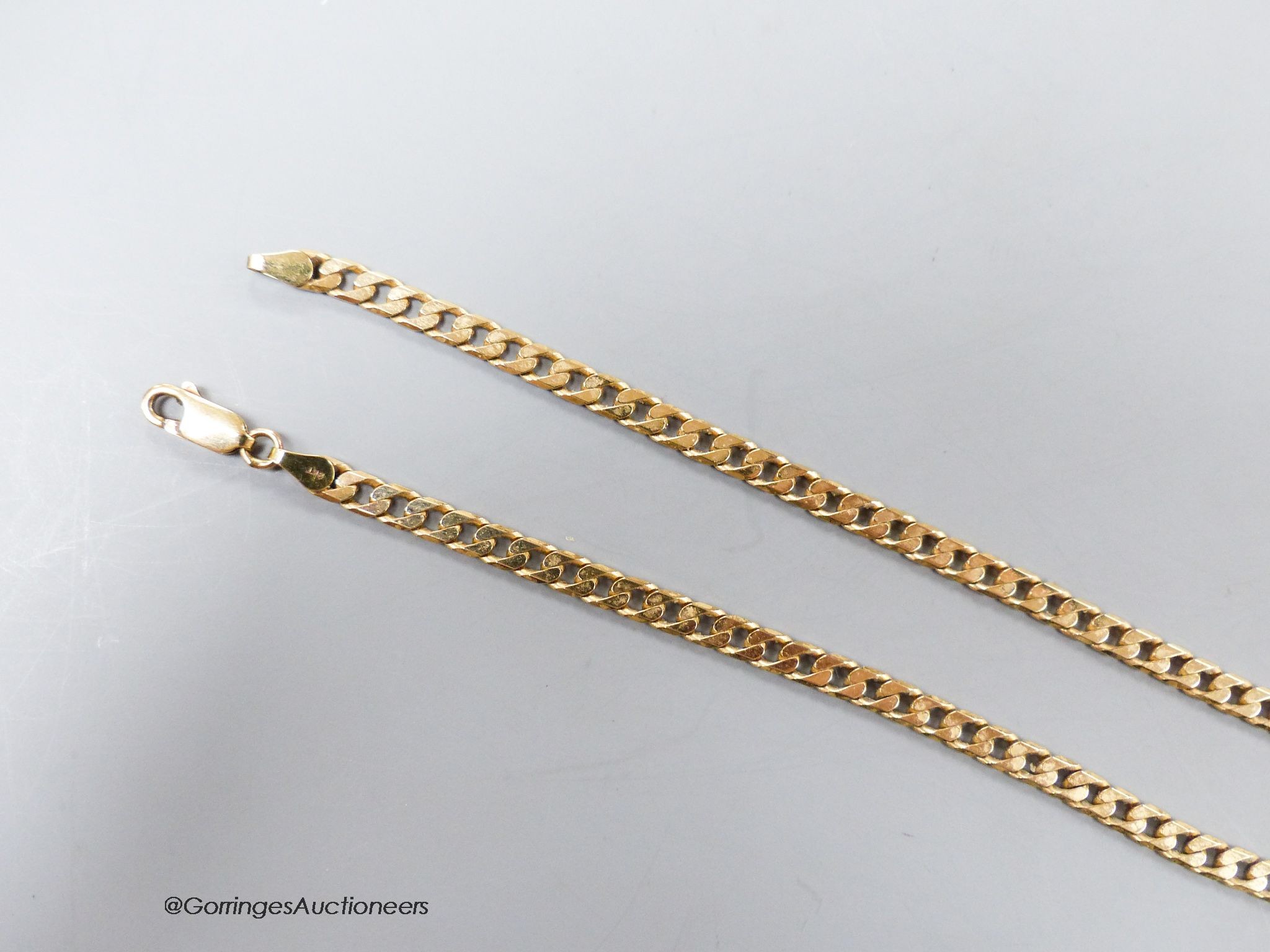 A 9ct gold flattened curb-link necklace, 47cm, 14.3 grams.